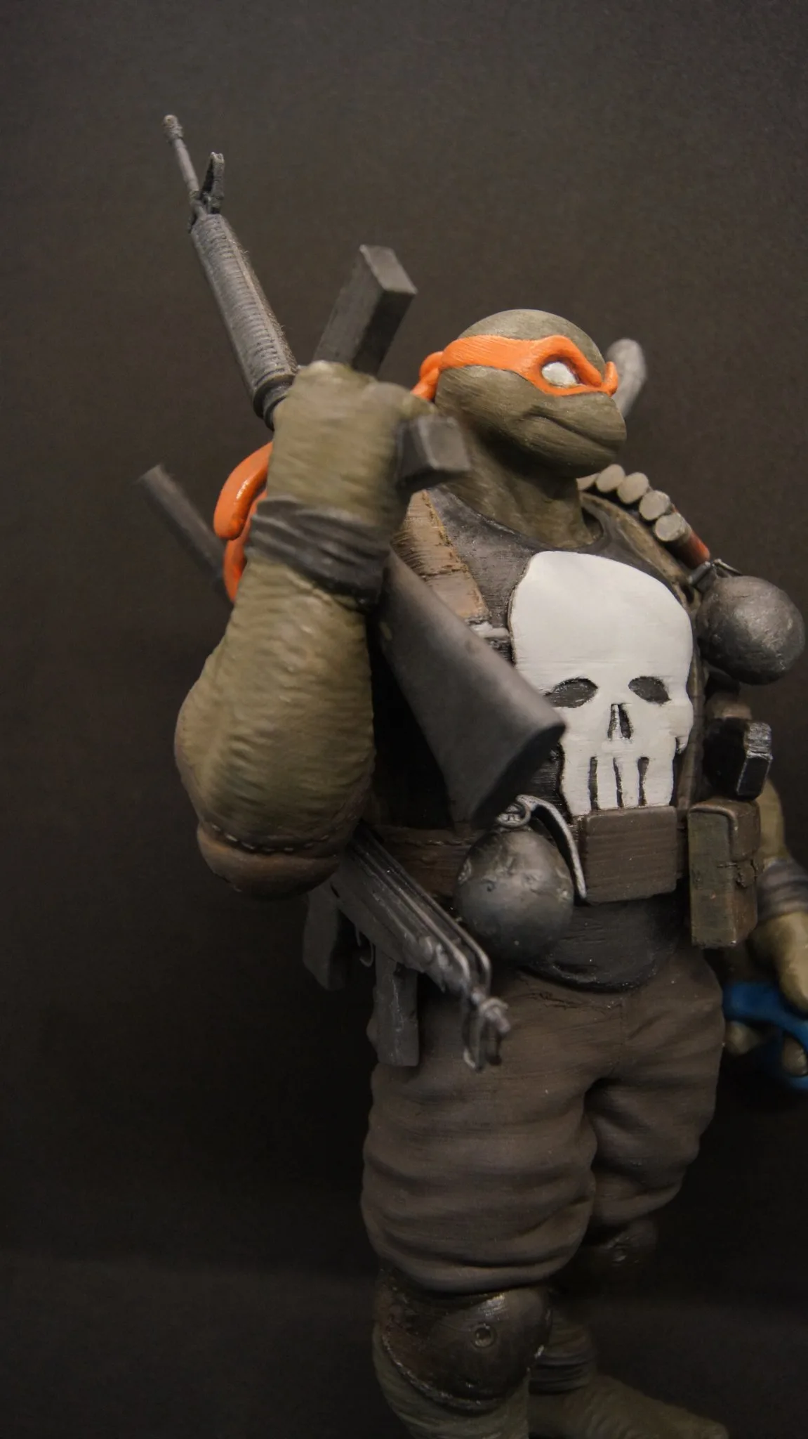 Close-up of Michelangelo Punisher's weapons and armor details