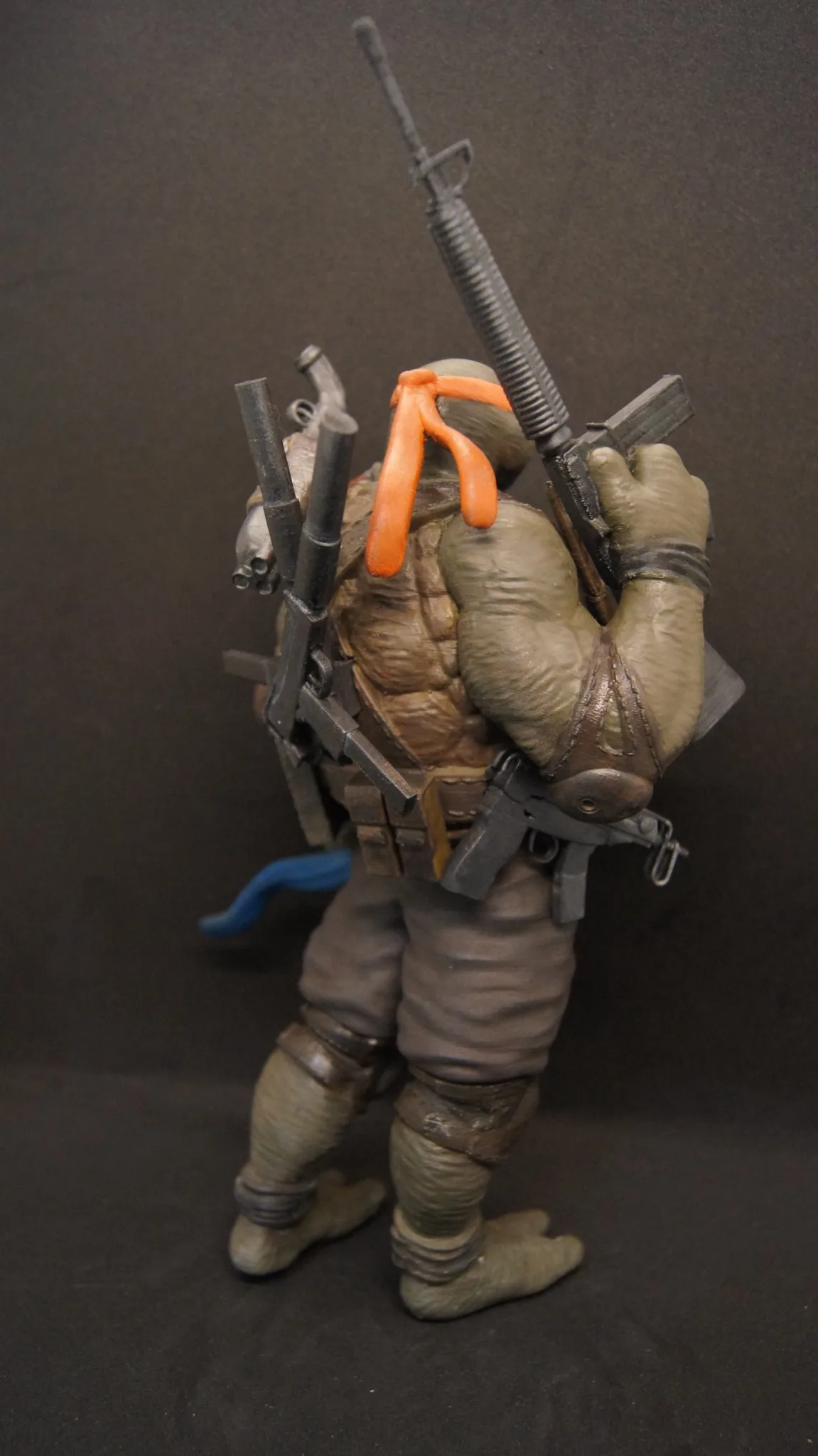Side profile of the Michelangelo Punisher hand-painted sculpture